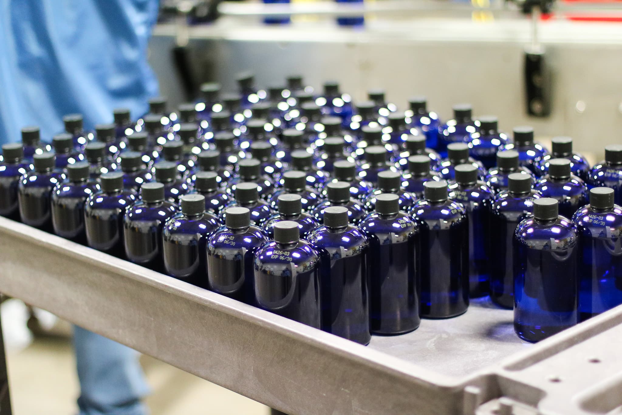 Liquid supplement bottles on the production line
